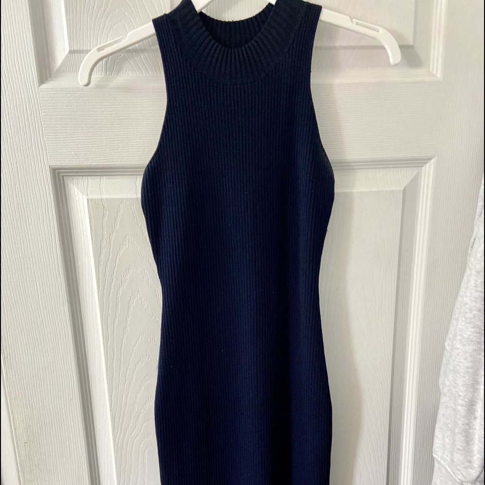 Navy blue dress fits down past the knees with a high neck line